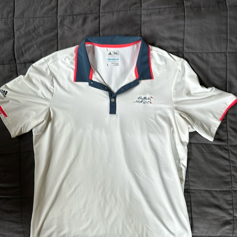 Adidas golf polo with Buffalo hills golf on left breast.